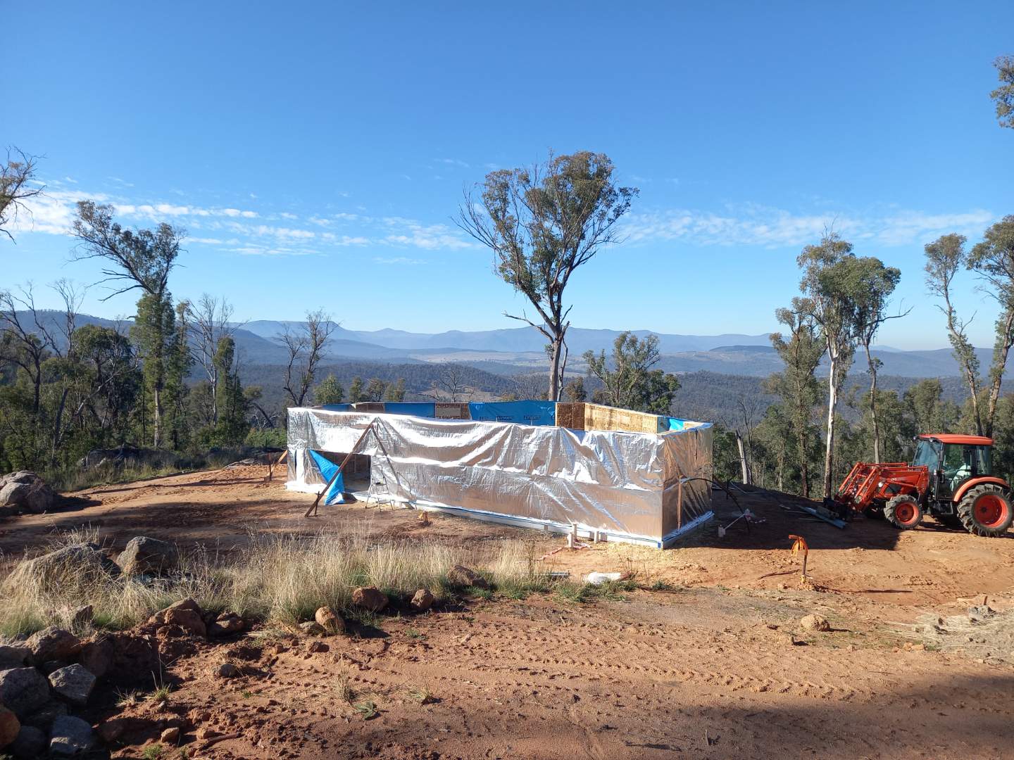 Ground floor strawbale panels house wrapped up by Shelter Building Design by SBD