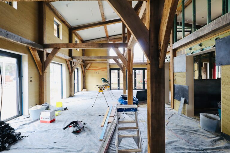 Traditional-Timber-framed-house-with-hempcrete-walls-under-construction.jpeg